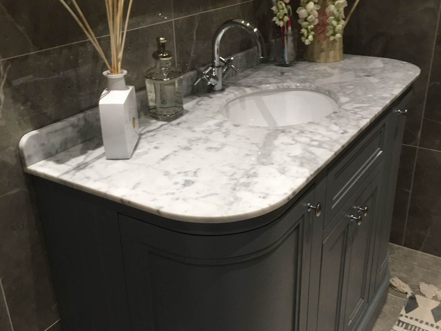 Curved vanity unit with marble top installed by Elite Building Services, Swords