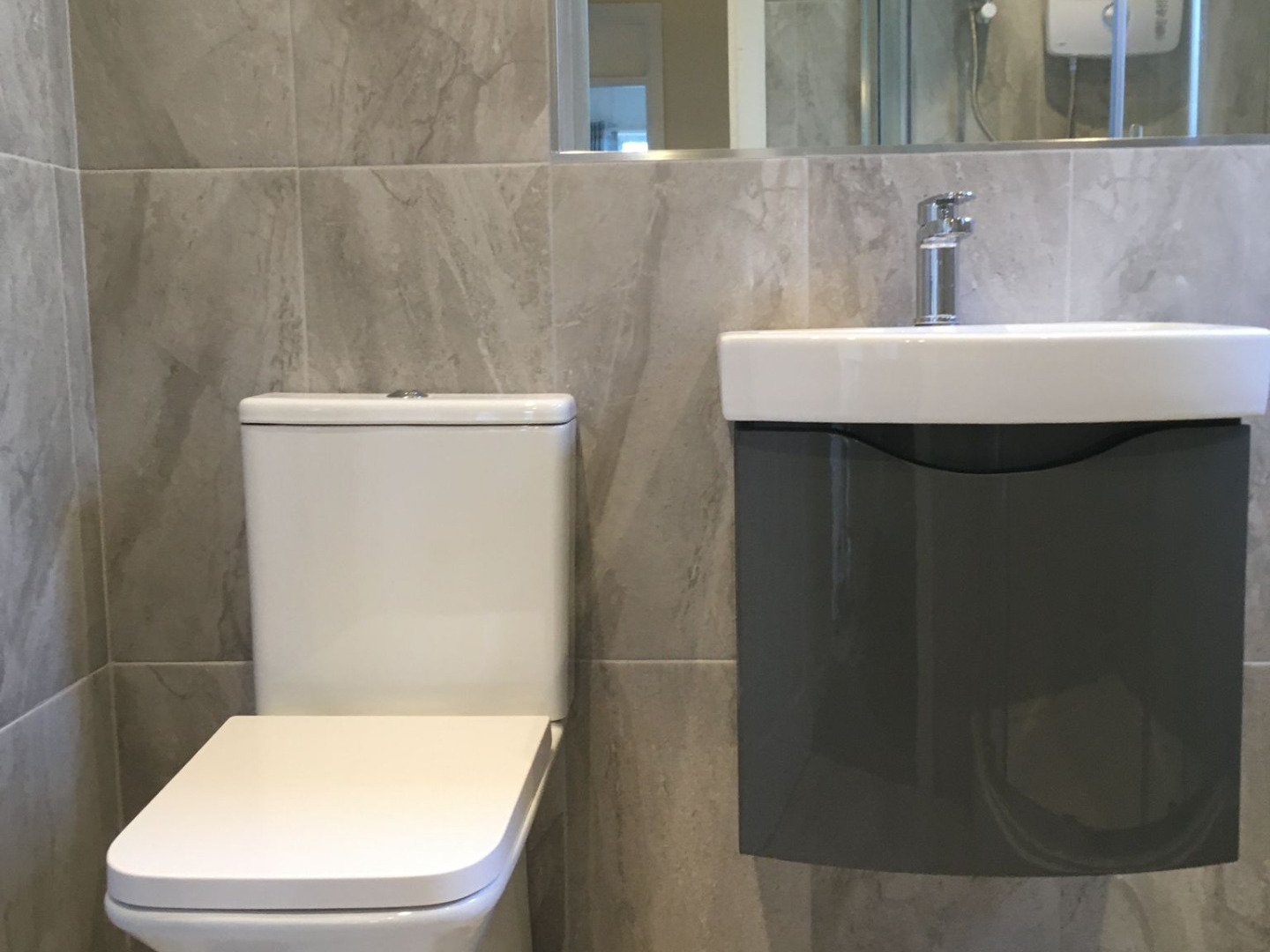 Bathroom renovation with floating vanity unit installed by Elite Building Services Swords