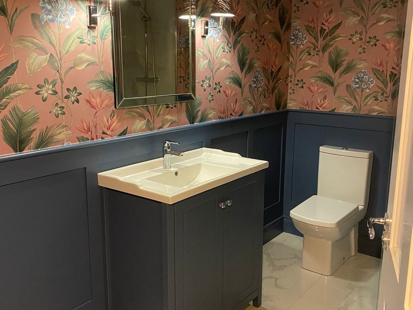 Wall panneled bathroom with wallpaper installed by Elite Building Services Swords